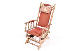 Early 20th century American turned beech framed rocking armchair.
