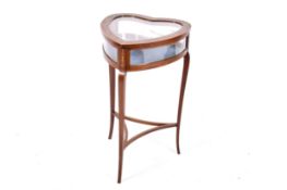 An Edwardian inlaid mahogany heart shaped bijouterie display table (af).