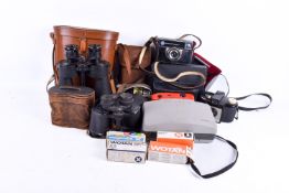 Collection of assorted vintage film cameras and binoculars.