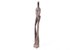 Large African tribal carved wooden 'Thinking Man' figure. Raised on a square base.