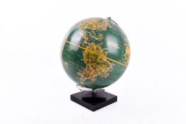 A mid-century Phillps' Pictorial Globe on a stepped square base.