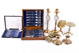 A group of assorted metalware item. Including pairs of brass candlesticks and plated cutlery, cased.