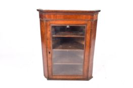 A Victorian mahogany corner bookcase cabinet.