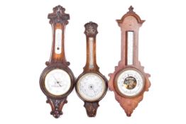 Oak cased wheel barometer and two other wheel barometers. Largest H87cm. (3).