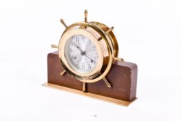 A Seth Thomas Helmman-W brass ships' wheel clock. Model E537-001.
