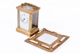 A five glass brass carriage clock and small mirror. Largest H11cm.