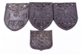 A group of three assorted cast iron Parish boundary plates and an 1823 lead version. Two dated 1892.