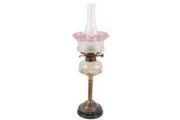 A Victorian patinated brass oil lamp.