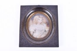 A late 18th/early 19th century miniature painting on ivory of a young girl.