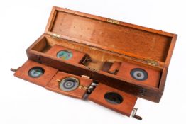 Eight 19th century mahogany mounted hand painted mechanical magic lantern slides.