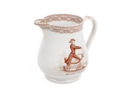 An 18th/19th century English creamware 'Velocipede' transfer printed jug.