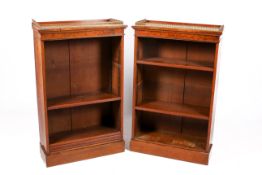 A pair of 20th century burr walnut bookcases.