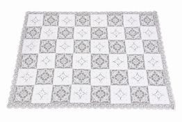 An antique lace tablecloth with twelve napkins.