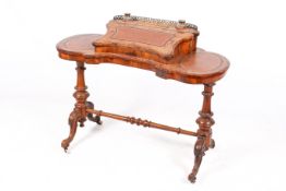 A 19th century Victorian kidney shape lady's writing desk.
