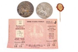 An assortment of 20th century souvenirs from the Olympic Games.