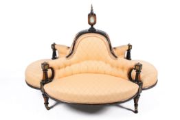 A Victorian four-seat conversation sofa.