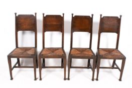 A set of four oak Arts & Crafts Liberty, William Birch style chairs.