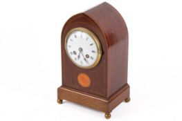 An Edwardian eight-day mantel clock.