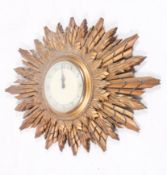 A mid-20th century Smiths gilt sunburst wall clock.