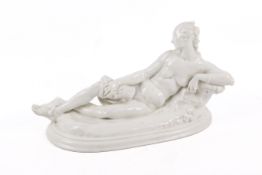 A KPM Berlin porcelain figure, designed by Paul Scheurich 'The Resting Women' designed.