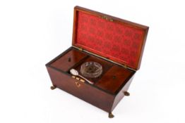 A Georgian mahogany sarcophagus tea caddy.