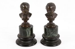 After Jean-Antoine Houdon (1741-1828), a small pair of bronze busts of children.