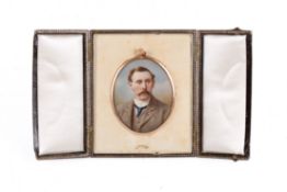 A late 19th/early 20th century miniature portrait of a gentleman on ivory.