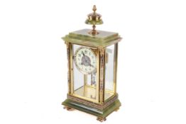 A late 19th/early 20th century onyx and enamel mantel clock.