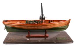 A mid-20th century live steam model of a ship.