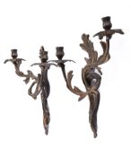 A pair of early 20th century Rococo style twin-arm wall sconces.