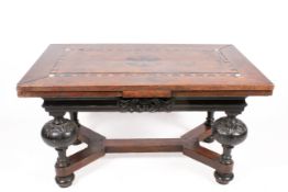 An antique oak draw-leaf table.