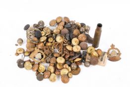 A collection of military badges and buttons and military relics.