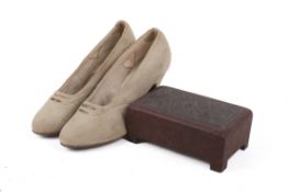 A pair of shoes belonging to the film star Mary Puckford (1892-1979) and a bakelite box.