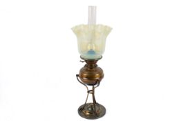 A Victorian patinated brass oil lamp and stand.