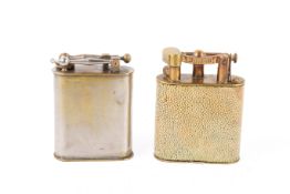 Two vintage table lighters. One by Dunhill, with shagreen coated body, patent number 143752, H10.