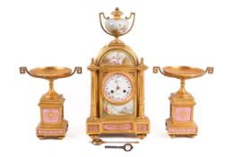 A 19th century French gilt-metal-mounted and porcelain eight-day mantel clock and garniture.