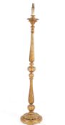 A Victorian carved giltwood standard lamp.