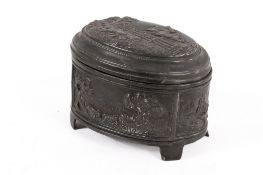 An oval pewter lidded box decorated with a hunting scene to the lid.