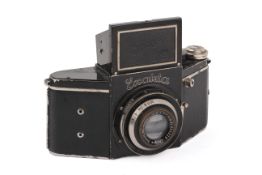An Ihagee Exakta Junior VP SLR Camera. Black. Serial number 432199. With an Jhagee Anast.