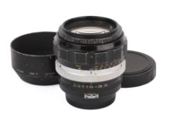 A Nikon 85mm f1.8 Nikkor-H Auto Non-AI F mount camera lens. Serial number 208058.