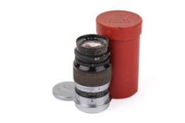 A Leitz 9cm f4 Elmar lens. Screw mount. Black. Serial number 295430.