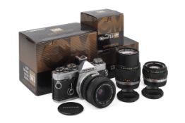 An Olympus OM-2N 35mm SLR Camera Outfit. Chrome. Serial number 1145341.