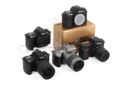Five Nikon SLR cameras. To include an F50, three F75's and a boxed F80. All untested.