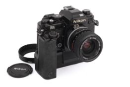 A Nikon FA 35mm SLR Camera. Black, Serial number 5109111. With a Nikon 35-70mm f3.3-4.