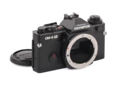An Olympus OM-4Ti 35mm SLR Camera Body. Black. Serial number 1192836. Untested.