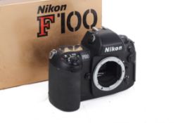 A Nikon F100 35mm SLR Camera Body. Black. Serial number 2044633. With makers box. Untested.