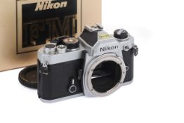 A Nikon FM 35mm SLR Camera Body. Chrome. Serial number 3451568.