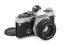An Olympus OM-2N 35mm SLR Camera. Chrome. Serial number 711666. With an Olympus 50mm f1.