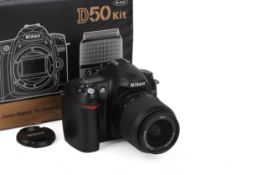 A Nikon D50 Digital SLR Camera. With an AF-S Nikkor 18-55mm f3.5-5.6 G ED DX. With makers box.
