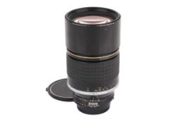 A Nikon F-mount AI 180mm f2.8 ED lens. Serial number 424887.